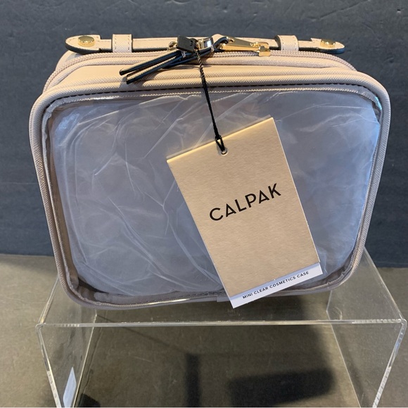 Calpak Handbags - CALPACK NWT Mini Clear Cosmetic Zippered Travel  Case. Stone.